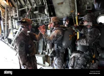 a-us-army-officer-receives-confirmation-from-the-first-paratrooper-that-all-jumpmaster-checks...webp